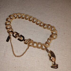 Monet: Gold tone Lord's prayer bracelet.